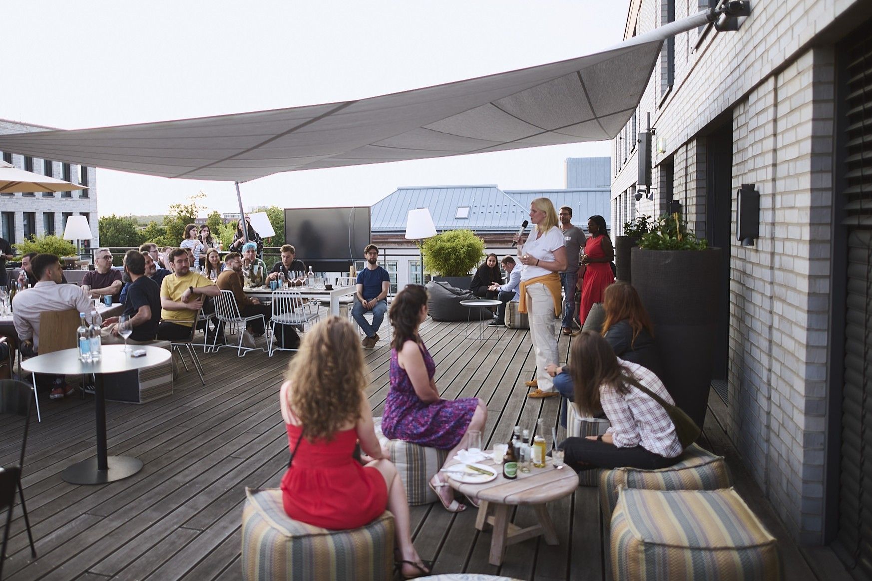 Adastra team knowledge-sharing session on a rooftop
